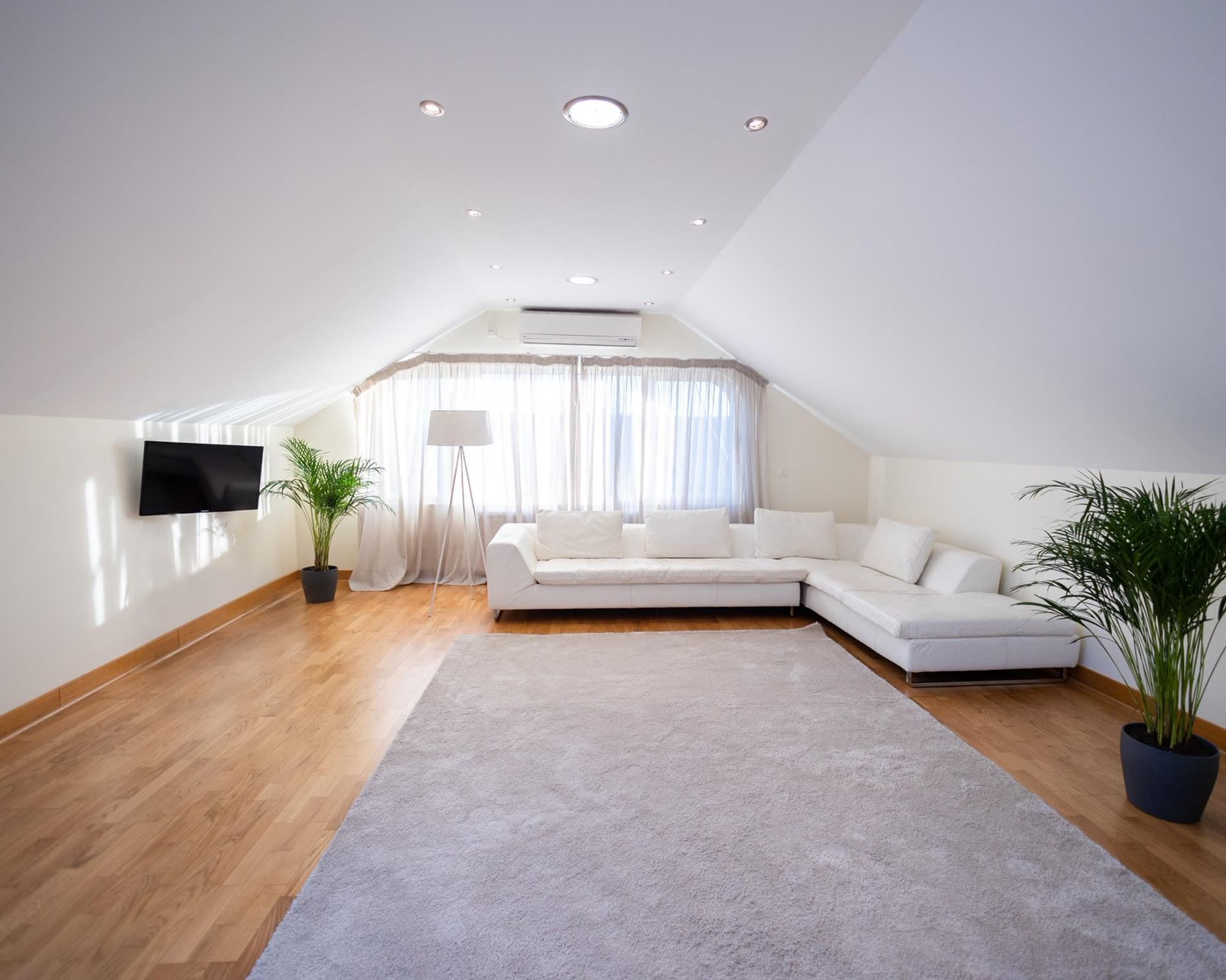 A bright, freshly cleaned living room with sunlight falling across the floor